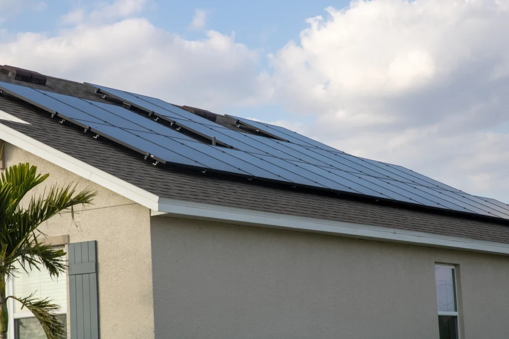 asphalt shingle roof covered in solar panels