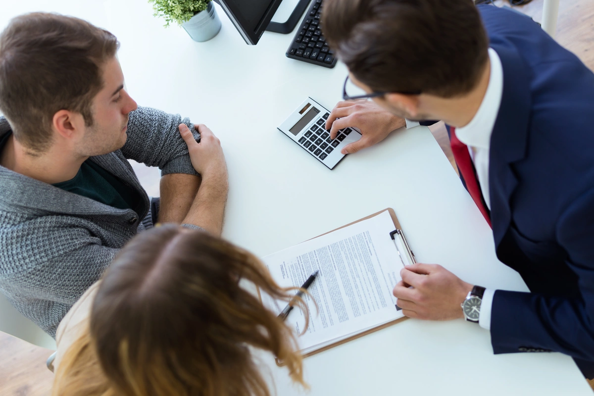 Couple talking with a banker