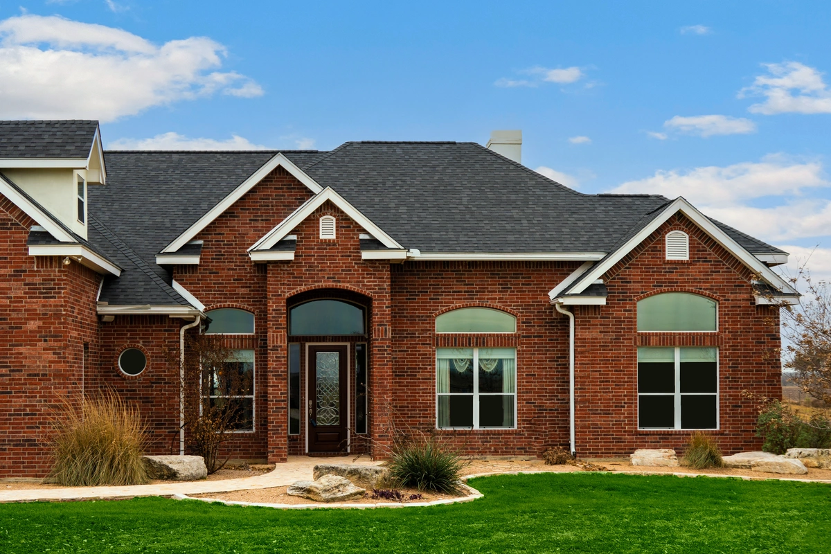asphalt shingle roof on brick house