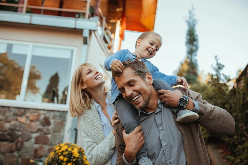 family of three in their backyard
