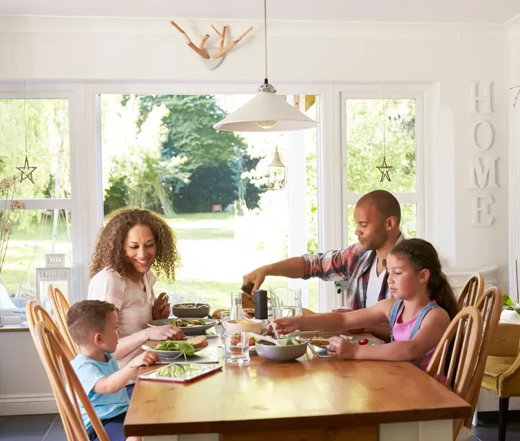 Florida homeowners eating at the dining table