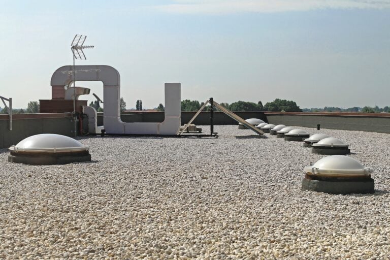 Flat Roof With Gravel and Skylight Windoows