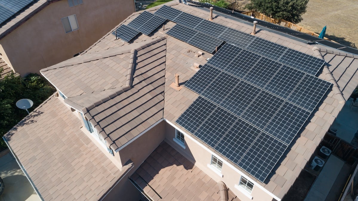 Solar Panels Installed on Roof of Large House