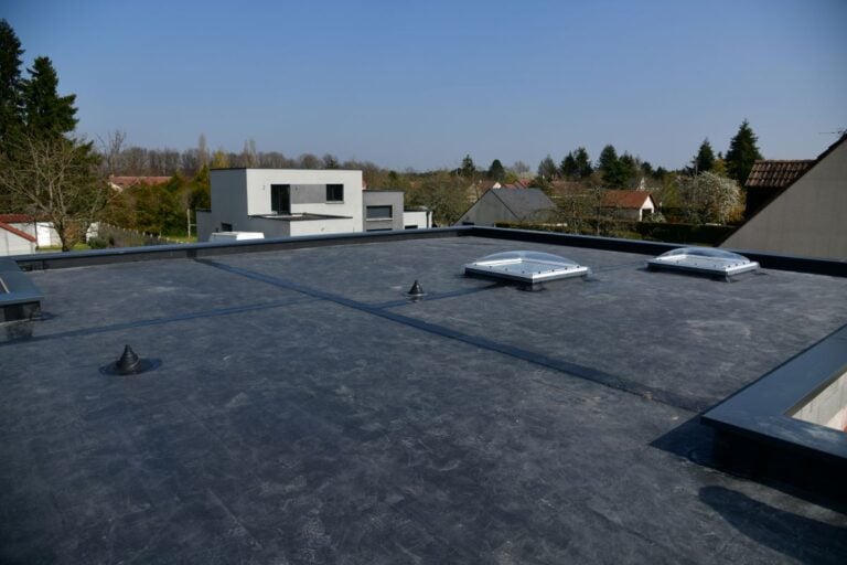 EPDM roof coating commercial building black coat sunny day