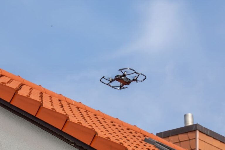 drone roof inspection close up orange tiles roof